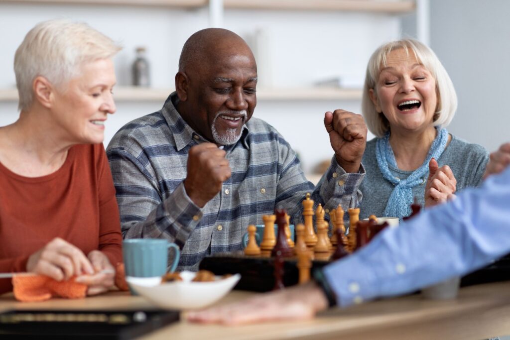 Friends playing games emphasizing the Importance of Social Connection for Seniors